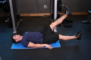 Man with prostatitis performs exercise in the gym