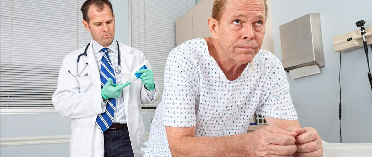 A man with prostatitis on the procedure of a doctor